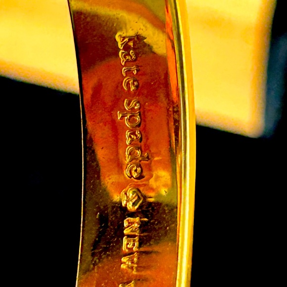 Kate Spade large bangle. Cream and gold with gold decorations for on the cream. - Picture 3 of 6